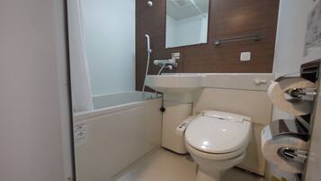 Combined shower/tub, free toiletries, hair dryer, slippers