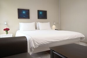 Habitación Deluxe | Sábanas de algodón egipcio, ropa de cama de alta calidad y edredón 
