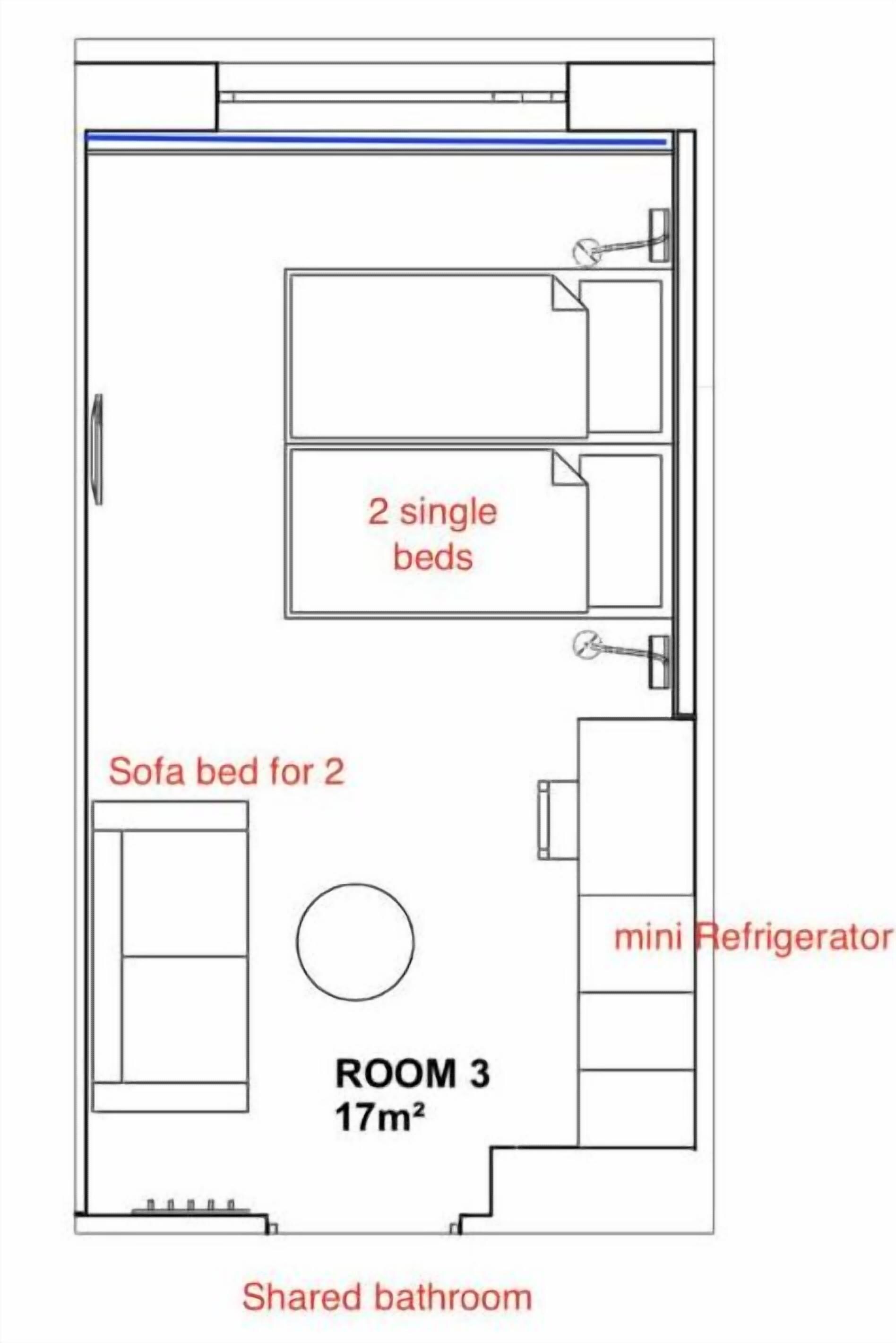 A floor plan of a room with 2 single beds, a sofa bed for 2, a mini refrigerator, and a shared bathroom.