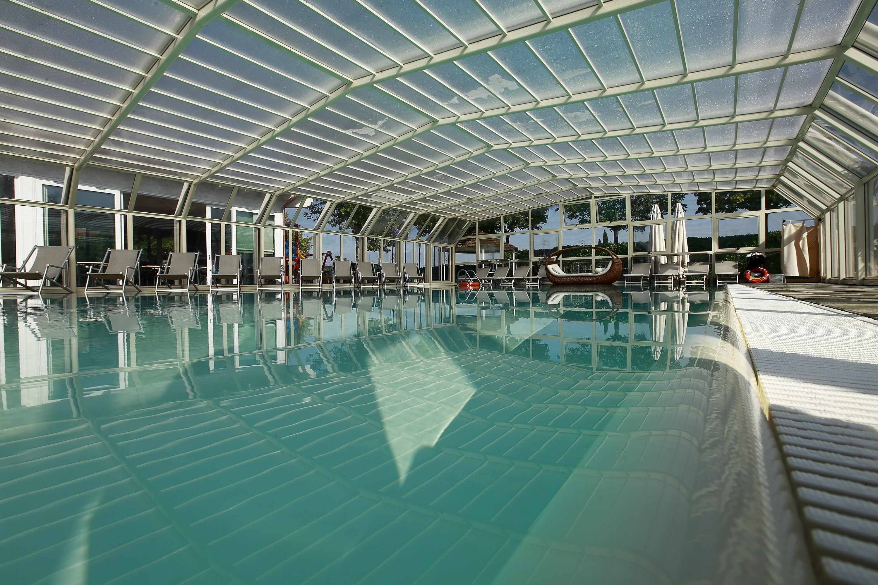 Indoor pool, 2 outdoor pools, open 10:00 AM to 10:00 PM, pool umbrellas