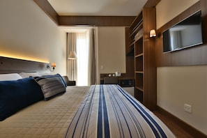 Luxe beddengoed, een minibar, een kluis op de kamer, een bureau
