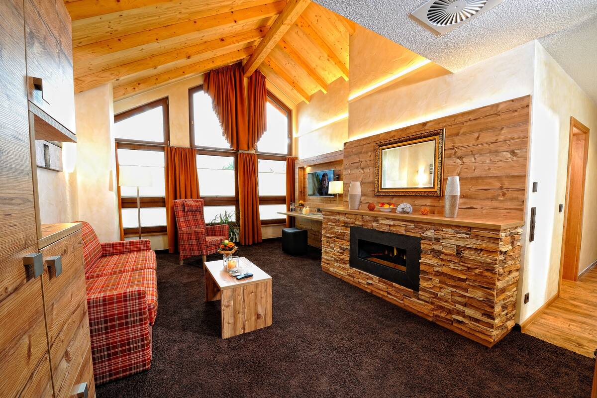 Honeymoon Suite, 1 Bedroom, Sauna | Living area | Flat-screen TV, first-run films