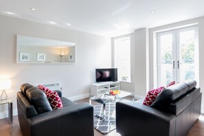 Apartment, 2 Bedrooms | Living room | Flat-screen TV