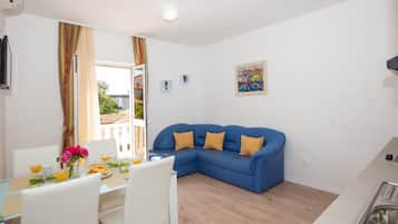 Apartment, 1 Bedroom | Living area | Flat-screen TV