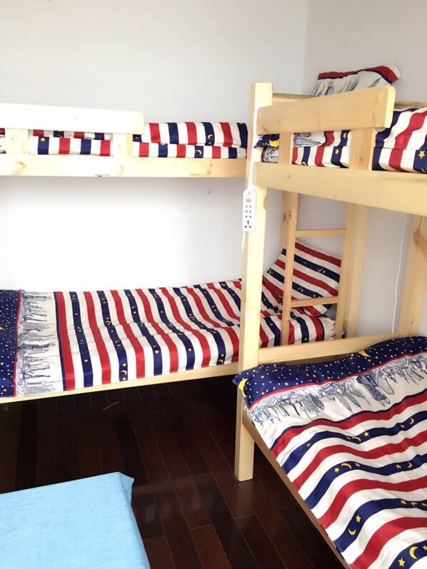 A bunk bed with two levels, each with a mattress featuring a star and crescent pattern. - Shanghai Sky168 Youth Hostel (Shanghai)