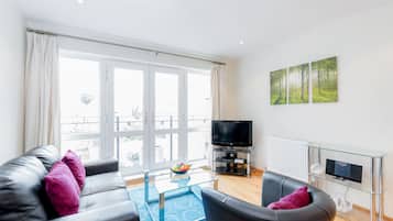 Apartment, 1 Bedroom | Living room | Flat-screen TV