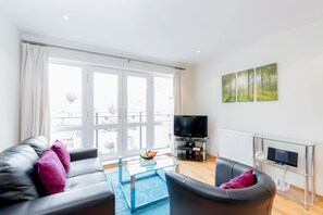 Apartment, 1 Bedroom | Living room | Flat-screen TV