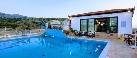 Seasonal outdoor pool, open 9:00 AM to 7:00 PM, pool umbrellas