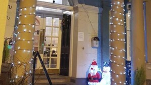 The George & Abbot's Hotel entrance with decorative lights and a Santa figure. - George and Abbotsford Hotel (Melrose)
