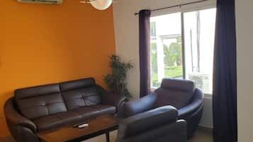 Standard Apartment, 1 Bedroom | Living room | 32-inch flat-screen TV with cable channels, TV
