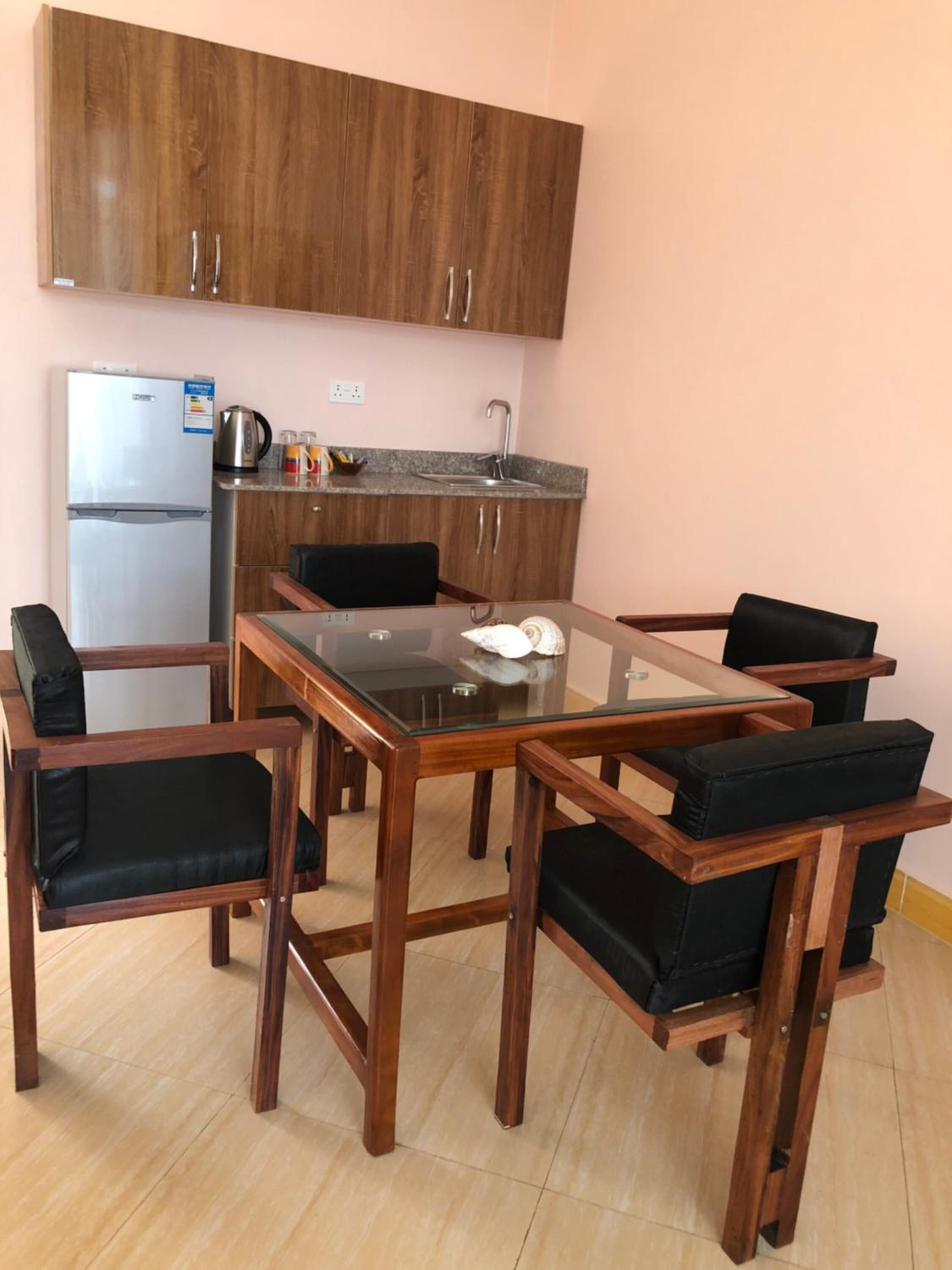 full-sized fridge, stovetop, electric kettle, cookware/dishes/utensils