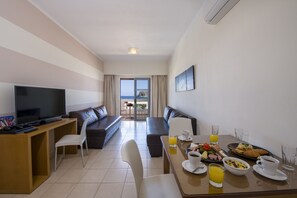 Panoramic Apartment, Resort View | Living area | 40-inch flat-screen TV with digital channels, TV, toys - Isida Hotel (Chania)