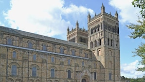 A historic building with a large central tower and a smaller adjacent structure. - Old Hall Cottage No 1 (Byers Green, near Durham)