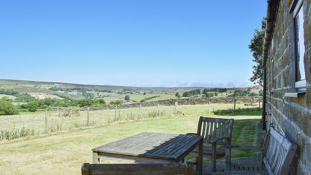 A patio with a table and benches overlooking a rural landscape. - 3 bedroom accommodation in Westerdale, near Castleton (Westerdale, near Castleton)