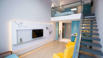 Business Loft (A) | Living area | Flat-screen TV