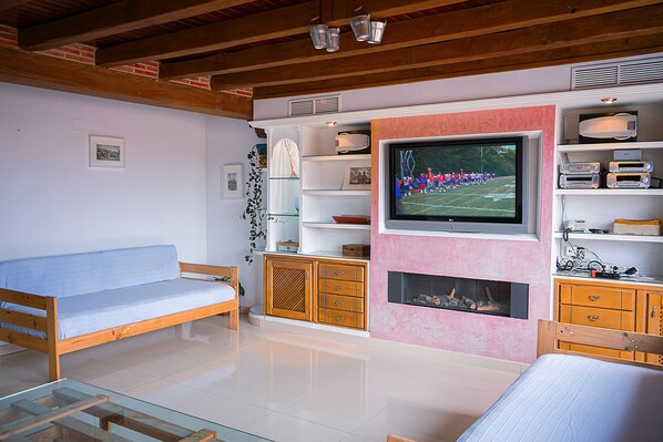 Smart TV, fireplace, DVD player, foosball