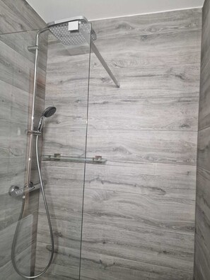 Shower, hair dryer, bathrobes, towels