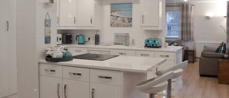 Dishwasher, highchair, cookware/dishes/utensils