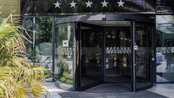 A modern building with a glass entrance and the word 'HAMILTON' prominently displayed.