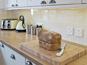 Dishwasher, highchair - Relax in front of the woodburner in this single-storey barn conversion. (Culmington, near Ludlow)