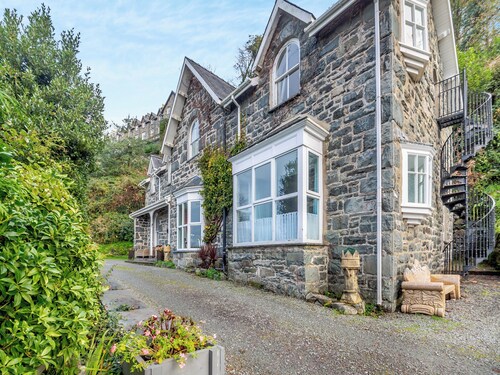 A large detached mansion with open fire and cinema room.