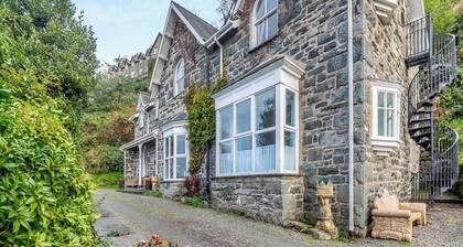 A large detached mansion with open fire and cinema room.