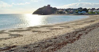 A spacious detached property with an open fire and enclosed garden.