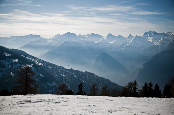 A snow-covered mountain landscape with a clear sky.