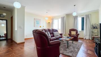 Apartment, 2 Bedrooms, Terrace (Garajau) | Living area | Flat-screen TV