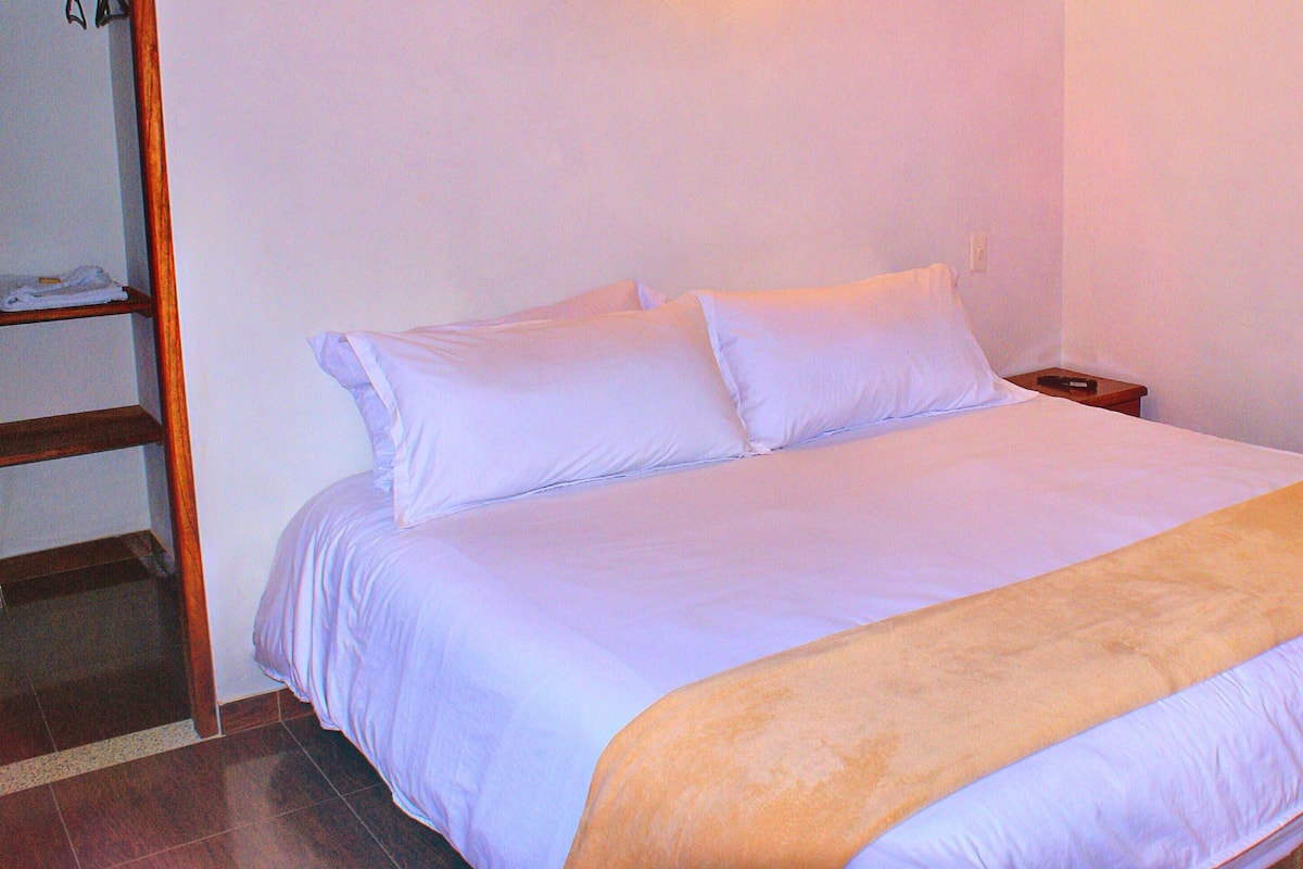 Standard Suite, 1 King Bed, Non Smoking | Blackout drapes, iron/ironing board, free WiFi, bed sheets