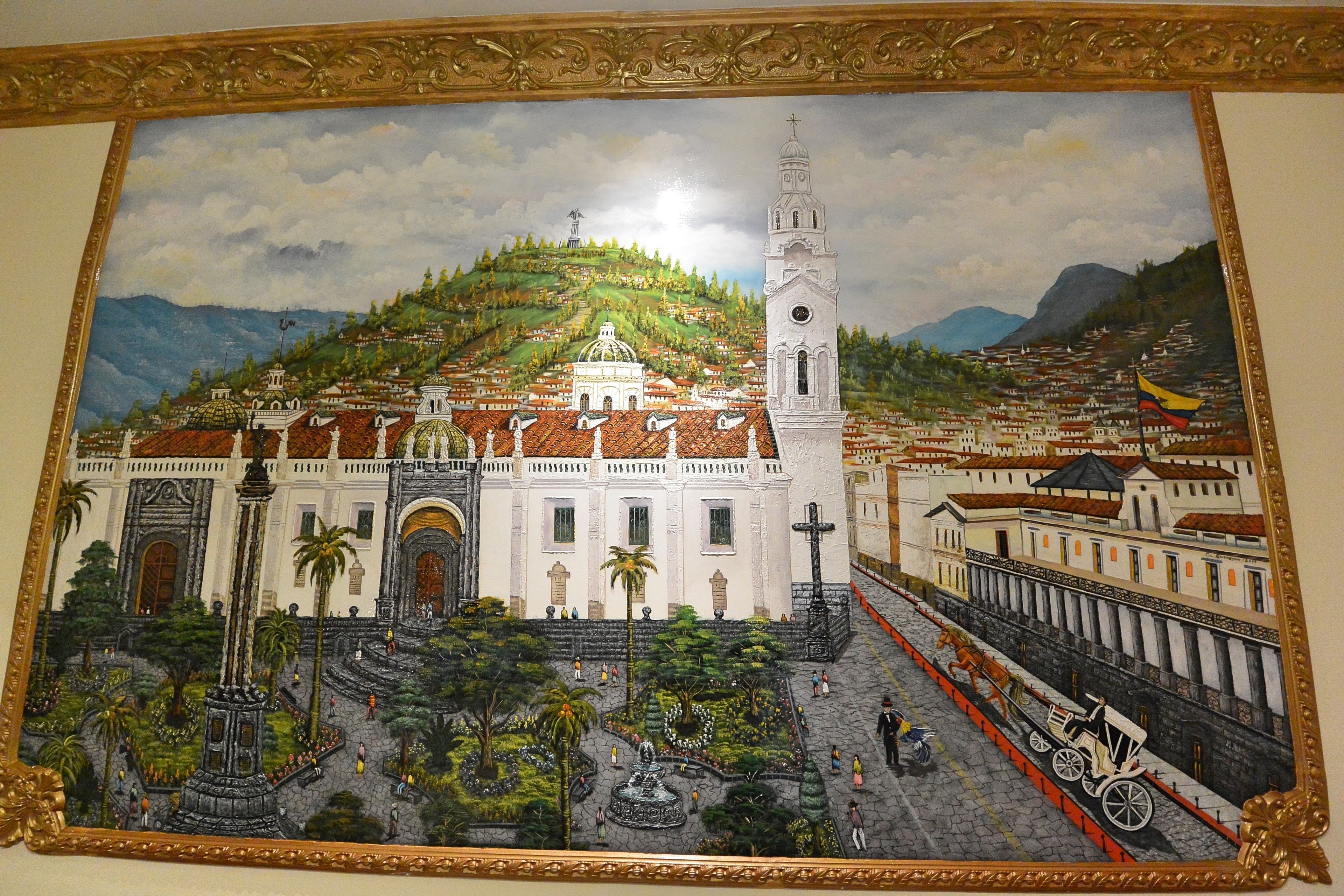 A mural of a cityscape with a prominent church, a hill, and a flag.