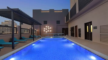 Outdoor pool, open 8:00 AM to 8:00 PM, pool umbrellas, pool loungers