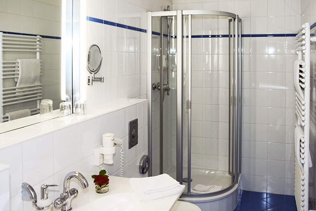 premium studio | bathroom | shower, free toiletries, hair dryer, towels