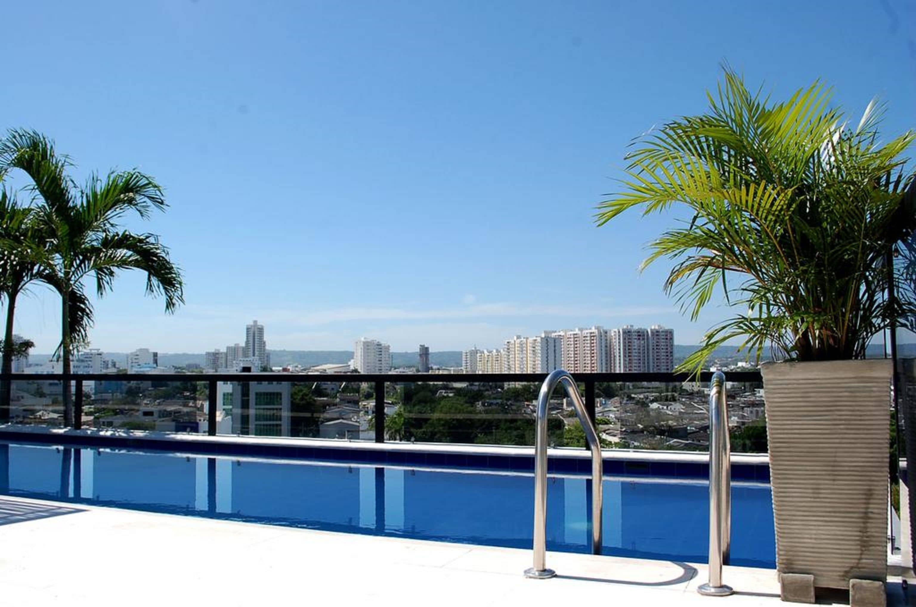 Outdoor pool, open 9:00 AM to 7:00 PM, pool loungers