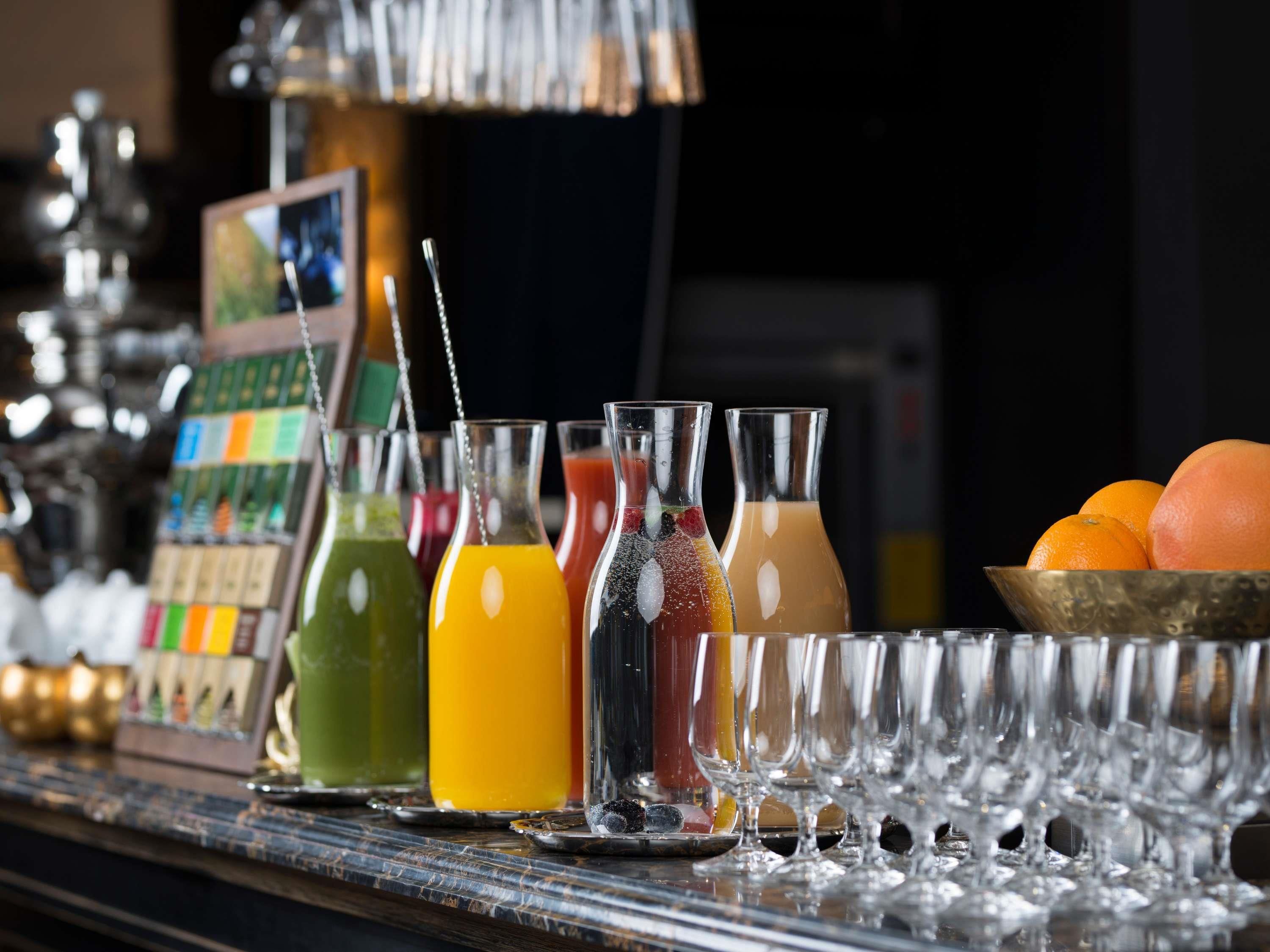 A bar area with various drink bottles and glasses.