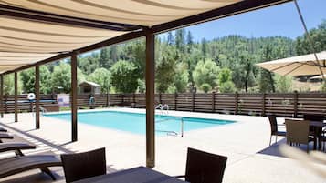 Seasonal outdoor pool, open 7:00 AM to 9:00 PM, pool umbrellas