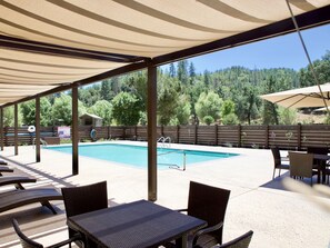 Seasonal outdoor pool, open 7:00 AM to 9:00 PM, pool umbrellas