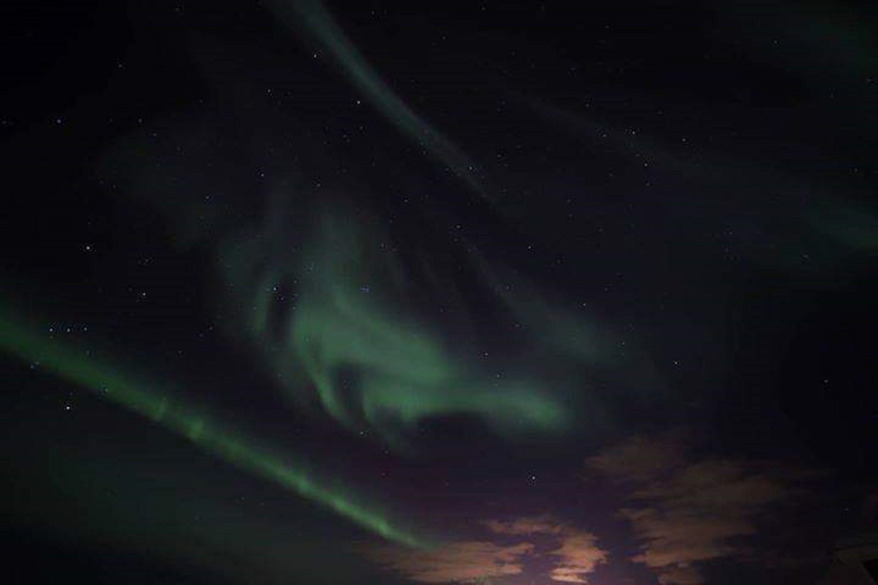 A night sky with visible aurora borealis.