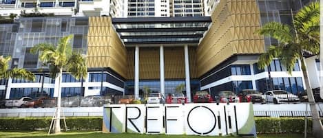 A modern building with a prominent 'TREFOIL' sign in front.
