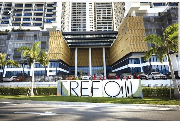 A modern building with a prominent 'TREFOIL' sign in front.