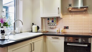 A kitchen with a sink, a kettle, a toaster, and a stove. - 1 bedroom accommodation in Pembury, near Tunbridge Wells (Pembury, near Tunbridge Wells)