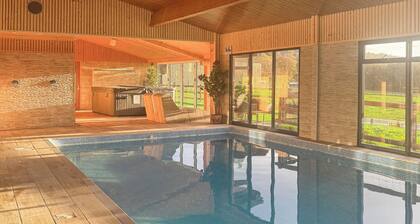 Relax in the shared indoor heated swimming pool, hot tub or sauna.