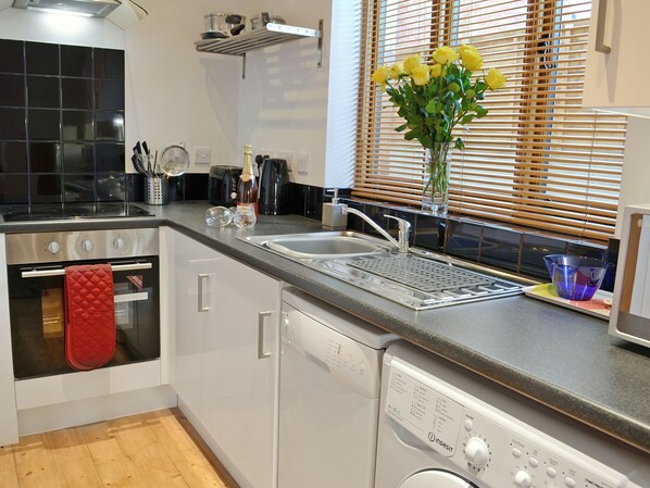 Dishwasher, high chair, cookware/dishes/utensils