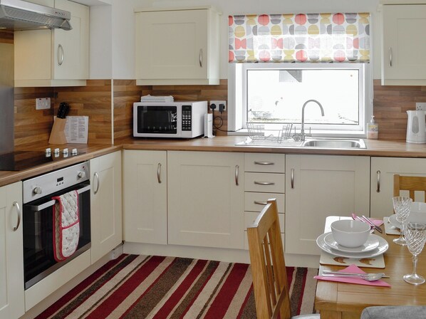 Fridge, microwave, cookware/dishes/utensils