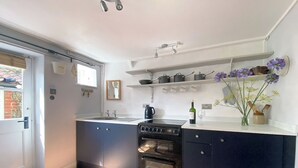 Private kitchen - Boasting charm and character, this 3 storey cottage enjoys a cosy woodburner. (Blakeney)