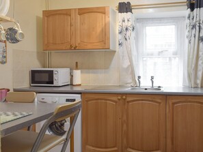 Fridge, microwave, cookware/dishes/utensils