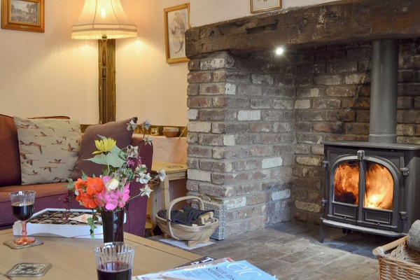 Delightful living room with cosy wood burner | Henley Bridge Holiday Cottage, Ashburnham, near Battle
