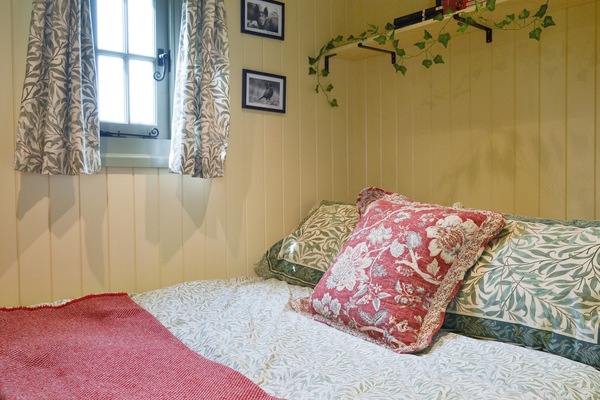 Comfortable double bed in sleeping area | Farmer Oak’s Hut, Dippertown, near Tavistock