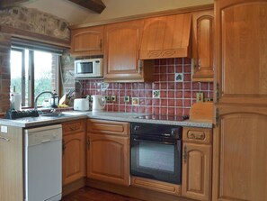 Dishwasher, high chair - 1 bedroom accommodation in Whitwell Farm, Colyford, near Seaton (Whitwell Farm, Colyford, near Seaton)