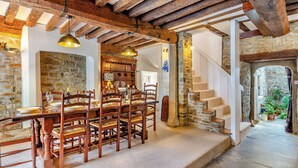 A rustic dining area with wooden furniture and exposed beams. - 4 bedroom accommodation in Stratton, near Bude (Stratton, near Bude)